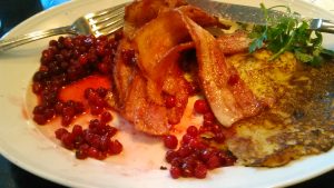 Potato pancakes with lingonberries and bacon