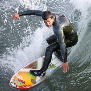 Surfer at the Cayucos Pier, California