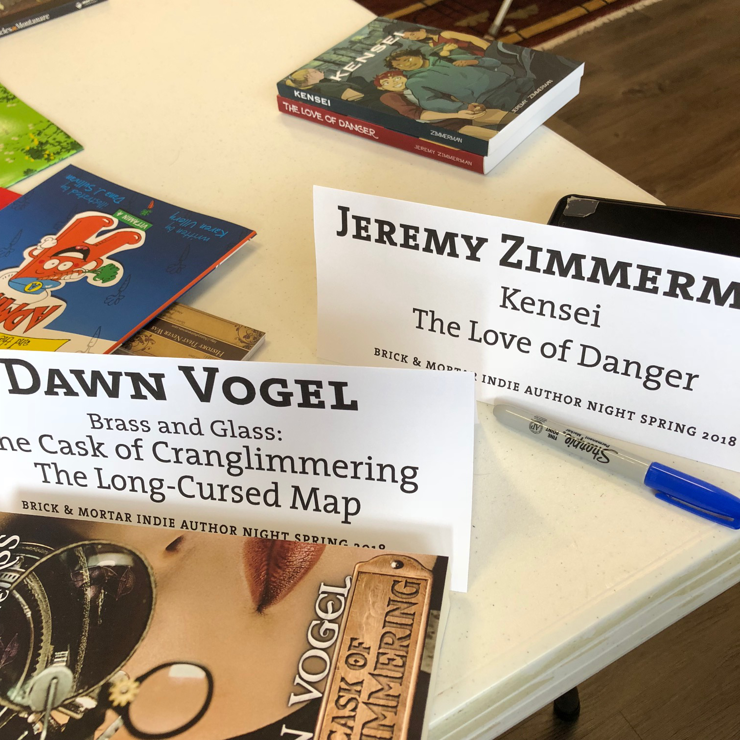Photo of name tags and books.