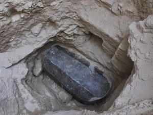 Recently unearthed black granite sarcophagus
