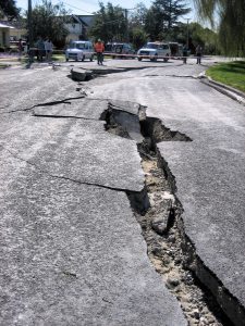 Large crack in road surface caused by earthquake