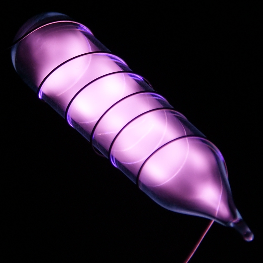 Tube containing ultrapure helium, which glows a purple-pink color