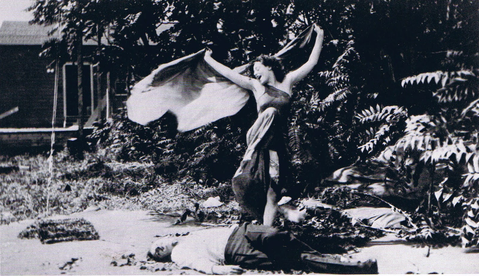 Still from the 1913 film The Vampire, picturing a female vampire standing over a man who she has defeated
