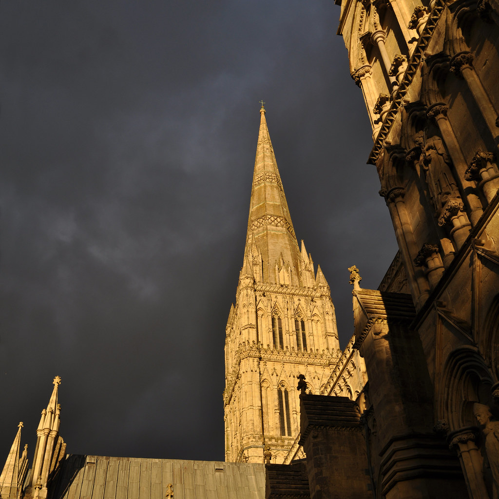 Salisbury Cathedral spire under stormclouds